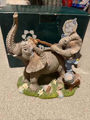 Tuskers elephant figurine with - tuskers,